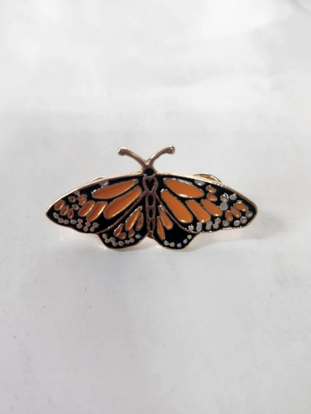 enamel over metal monarch butterfly pin brooch